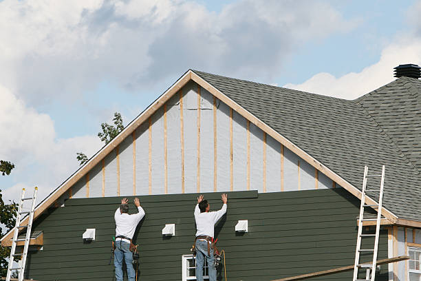 Professional Siding technician working in Paoli, IN
